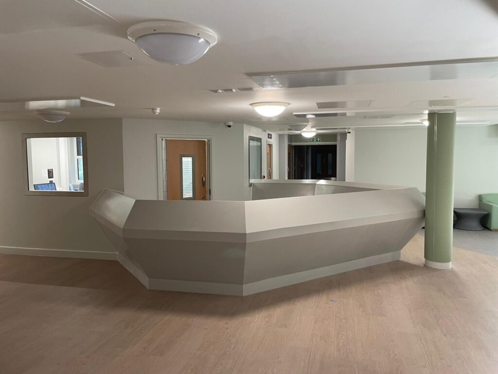Improving Hospital Ward Functionality – Bespoke Corian Reception Desk